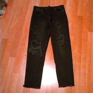 A pair of black ripped jeans